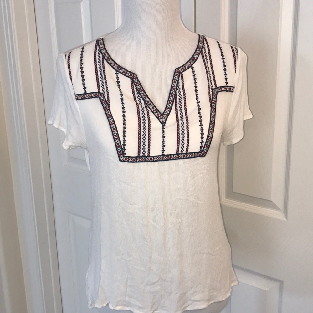 White top with neck detailing in patriotic colors